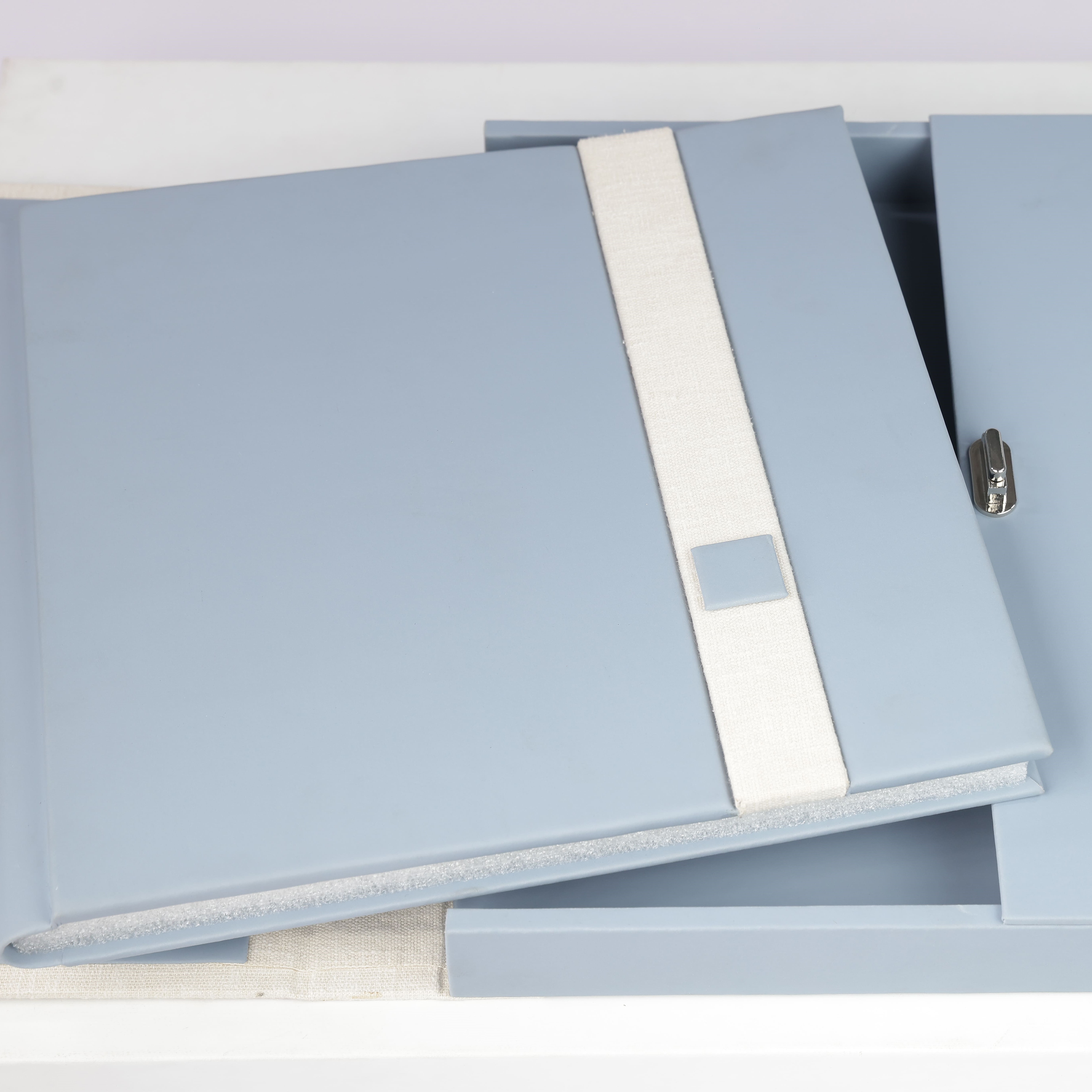 A corporate album with a minimal embossed cover